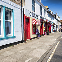 Buy canvas prints of Millport Main Street by Valerie Paterson