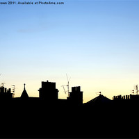 Buy canvas prints of Silhouetted Rooftops at Dusk by Craig Brown