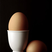 Buy canvas prints of Brown Eggs in Egg Cup by Craig Brown