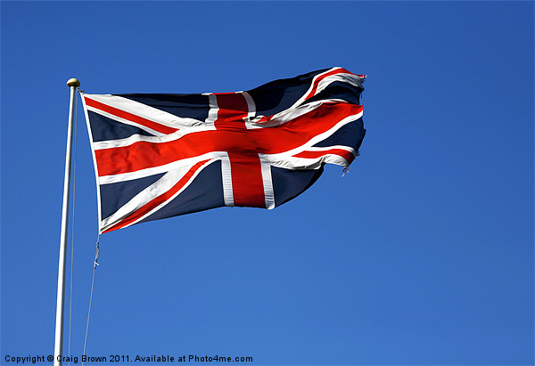 Union Jack on blue sky Picture Board by Craig Brown