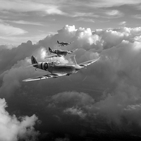 Buy canvas prints of Spitfires among clouds black and white version by Gary Eason
