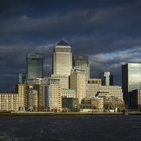 Buy canvas prints of Canary Wharf sunlit from the Thames by Gary Eason
