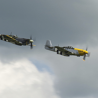Buy canvas prints of Spitfire and Mustang tail chase by Gary Eason