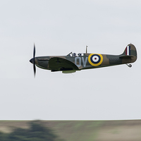 Buy canvas prints of Spitfire low-level flying by Gary Eason