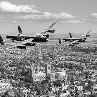 Buy canvas prints of Two Lancasters over Lincoln Cathedral black and wh by Gary Eason