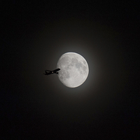 Buy canvas prints of Airliner passing in front of the Moon by Gary Eason