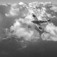 Buy canvas prints of Soaring silver Spitfire cloudscape black and white by Gary Eason