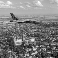 Buy canvas prints of Avro Vulcan passing Lincoln Cathedral black and wh by Gary Eason