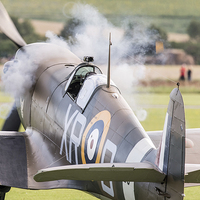 Buy canvas prints of Spitfire engine blowing smoke rings by Gary Eason