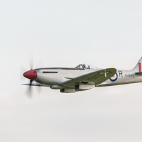 Buy canvas prints of  Silver Spitfire at speed by Gary Eason
