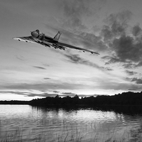 Buy canvas prints of Vulcan low over a sunset lake sunset lake B&W vers by Gary Eason