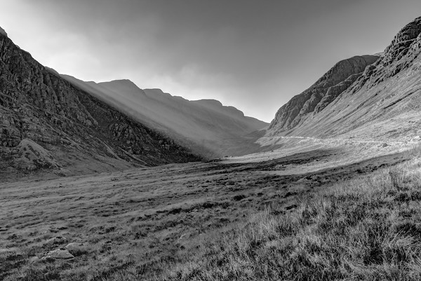 Afternoon sun rays in Bealach na Ba black and whit Framed Mounted Print by Gary Eason