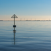 Buy canvas prints of Seashore marker post and wind turbines by Gary Eason