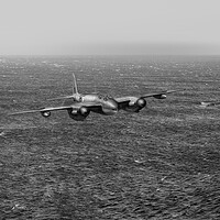 Buy canvas prints of Armed reconnaissance Mosquito over the North Sea B&W version by Gary Eason