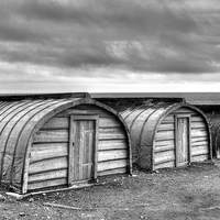 Buy canvas prints of Lindisfarne Boat Huts by Neil Young