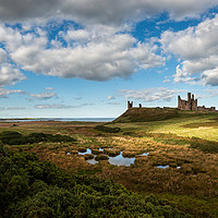 Buy canvas prints of Dunstanburgh Castle on the Northumberland Coast by Creative Photography Wales