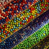 Buy canvas prints of  M & M sweet tubes by Raymond Partlett