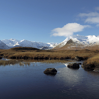 Buy canvas prints of A snow-capped Black Mount & Lochan Na H-Achlaise by Maria Gaellman