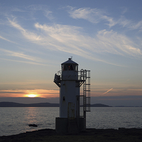 Buy canvas prints of Rhue Lighthouse at Sunset by Maria Gaellman