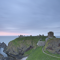 Buy canvas prints of Dunnottar Castle at Sunrise by Maria Gaellman