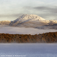 Buy canvas prints of Autumn mist shrouded between Mountain and Loch by Maria Gaellman
