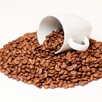 Buy canvas prints of Coffee Beans in a White Mug by Andrew Berry