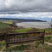 Buy canvas prints of Bench with a view of Robin Hoods Bay by Angela Wallace