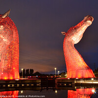 Buy canvas prints of illuminated Kelpies with reflection by Angela Wallace