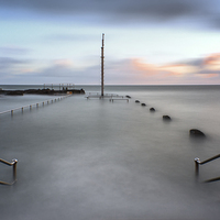 Buy canvas prints of  Ilfracombe Pier sunrise by Dave Wilkinson North Devon Ph