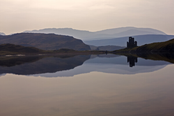 Ardvreck Castle Silhouetted and Reflected in Loch  Picture Board by Derek Beattie