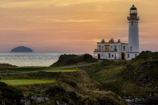 Turnberry Lighthouse and Ailsa Craig at Sunset Picture Board by Derek Beattie
