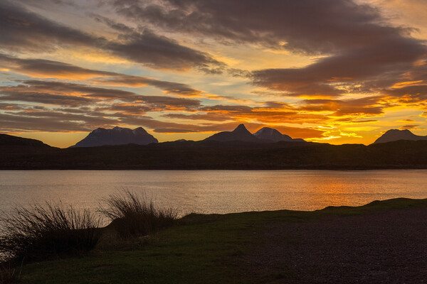 Radiant Silhouette of Assynt and Coigach Mountains Picture Board by Derek Beattie