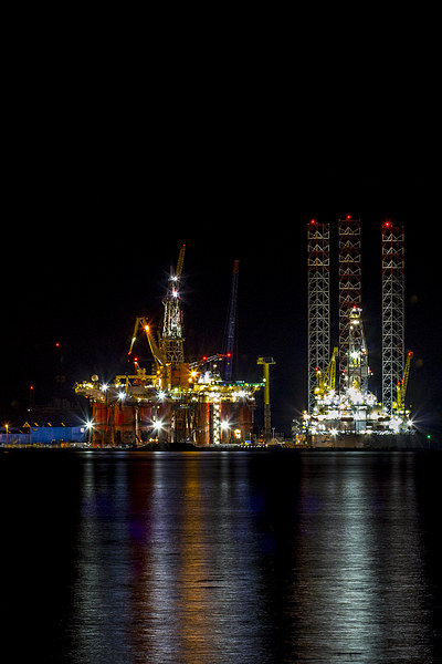 Oil Rig At Night Scotland Picture Board by Derek Beattie