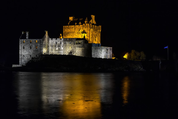 Eilean Donan Castle at Night Picture Board by Derek Beattie
