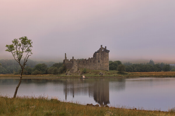 Kilchurn Castle at Dawn Picture Board by Derek Beattie