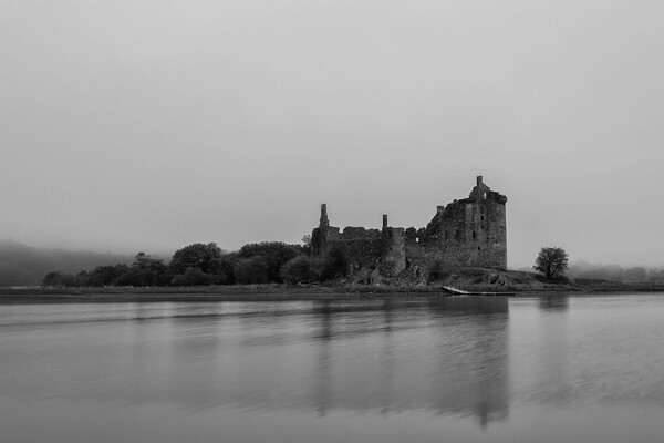 Kilchurn Castle in the Mist Picture Board by Derek Beattie