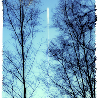 Buy canvas prints of Distant Aeroplane in Blue Sky by Natalie Kinnear