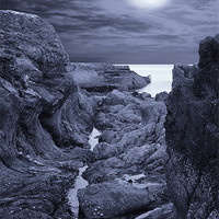 Buy canvas prints of Moonlight over Rugged Seaside Rocks by Jane McIlroy