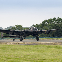 Buy canvas prints of Avro Lancaster takeoff by Dean Messenger