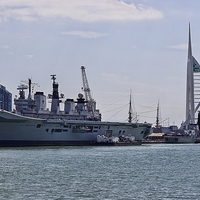 Buy canvas prints of  HMS llustrious and Spinnaker Tower by Dean Messenger