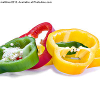 Buy canvas prints of colourful sliced peppers by meirion matthias