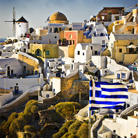 Buy canvas prints of Oia and a greek flag by meirion matthias