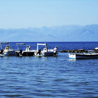 Buy canvas prints of  Albania behind the boats by Mandy Rice