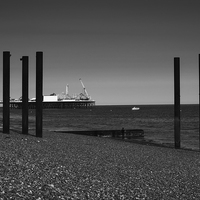 Buy canvas prints of Pier-ing through the struts  by Sara Messenger