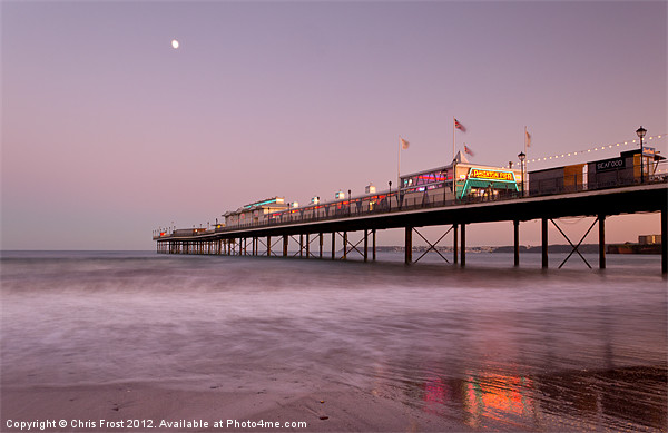 Paignton Pier Sunset at Sunset Framed Print by Chris Frost