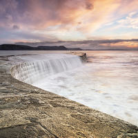 Buy canvas prints of Sunrise falls at Lyme Regis Cobb by Chris Frost