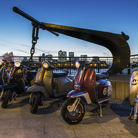 Buy canvas prints of Scooters and the City by Neal P
