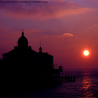 Buy canvas prints of Eastbourne pier silhouette at sunrise. by camera man