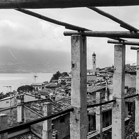 Buy canvas prints of  The rooftops of Limone sul Garda by Julian Bowdidge