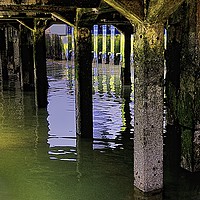Buy canvas prints of  UNDER THE JETTY                                   by Helen Cullens